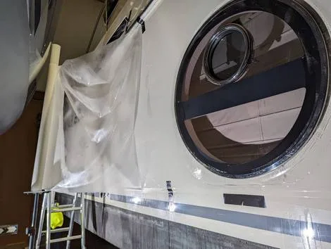 photo of applying protective coatings to the gelcoat of a yacht
